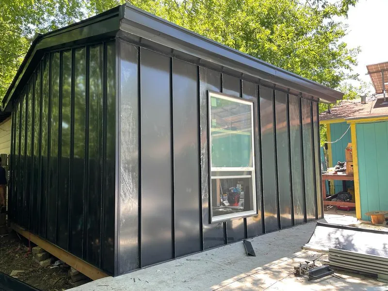 Black standing seam metal wall panels for Roof Inspection in Le Ray