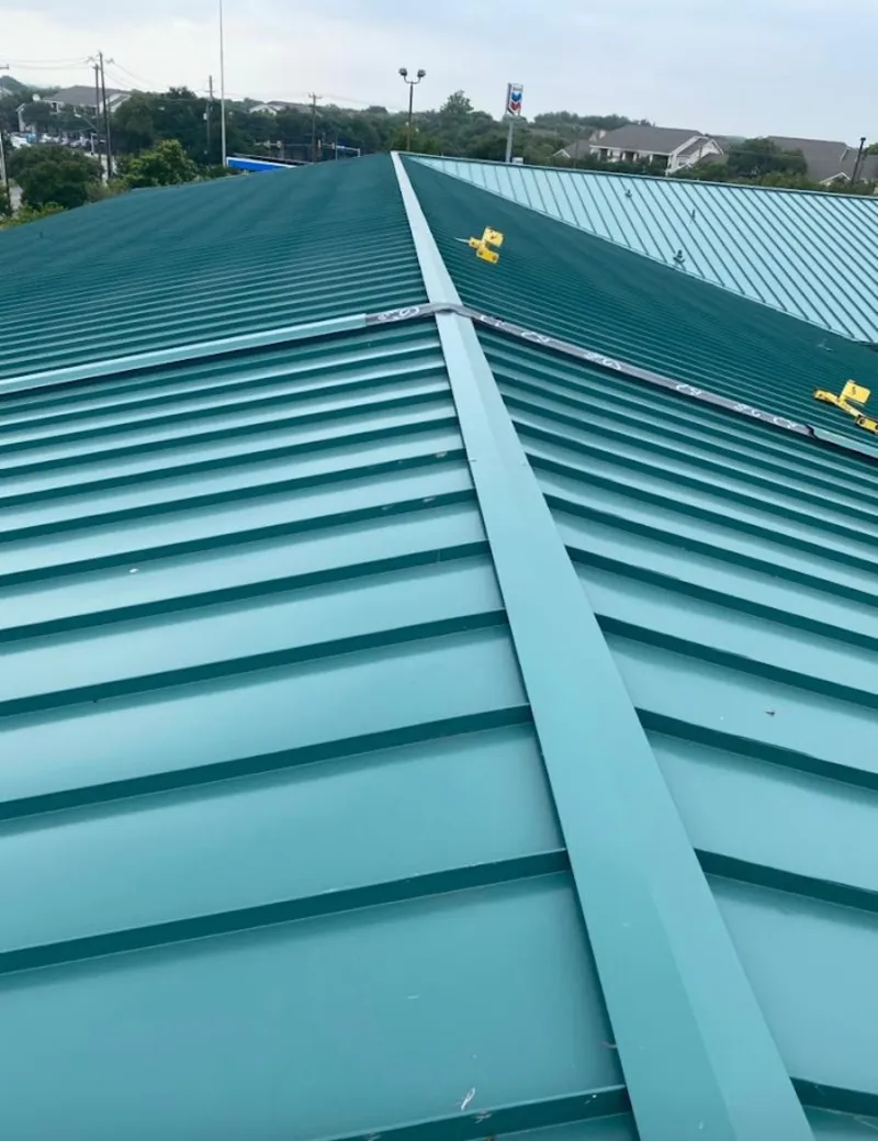 Green commercial metal roof ridge and valley for Metal Roof Repair in Le Ray